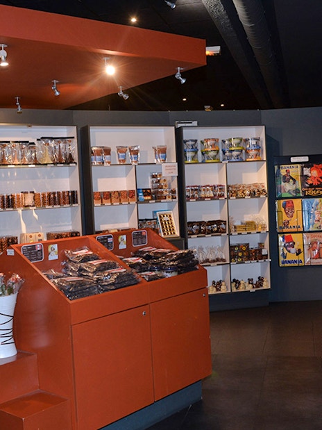 Choco-Story Paris interior with chocolate displays and merchandise shelves.