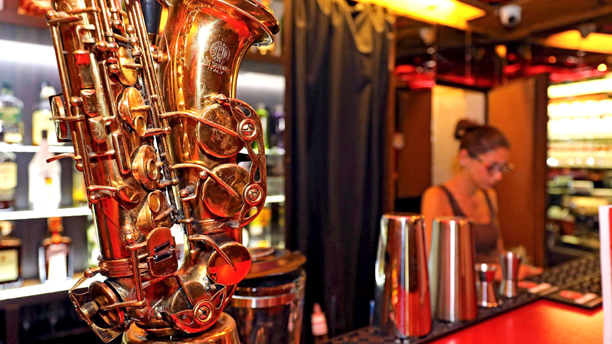 Saxophone on bar counter at Reduta Jazz Club, Prague.
