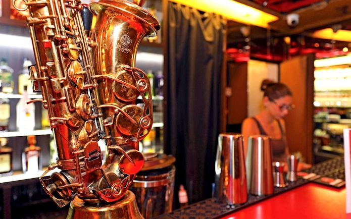Saxophone on bar counter at Reduta Jazz Club, Prague.
