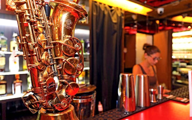 Saxophone on bar counter at Reduta Jazz Club, Prague.