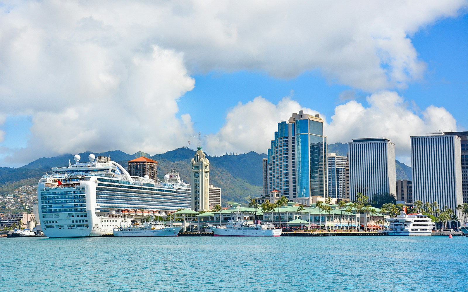 Honolulu harbor and downtown Honolulu condos next to Aloha Tower Marketplace on Oahu, Hawaii.