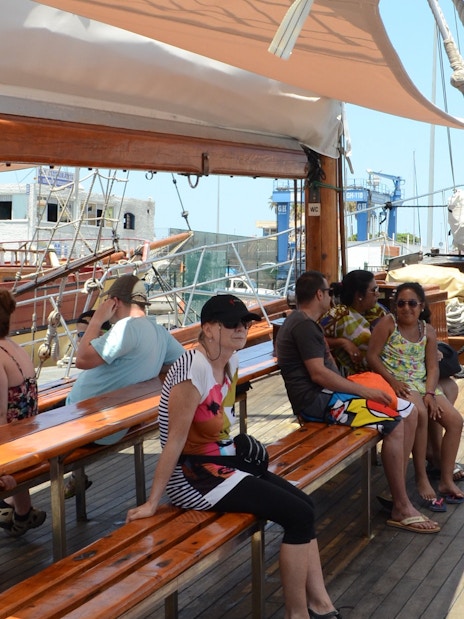 Tourists seated on Peter Pan Pirate boat in Tenerife, preparing for whale and dolphin watching.