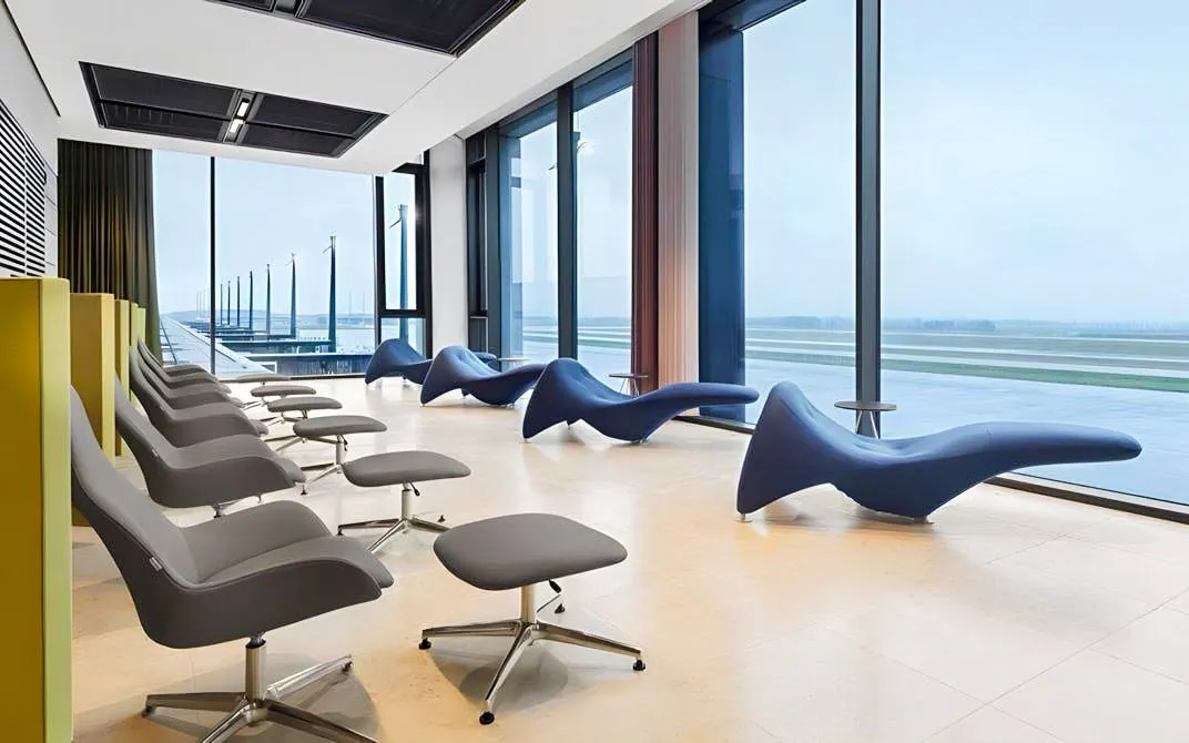 BER Lounge seating area with runway view at Berlin Brandenburg Airport Terminal 1.