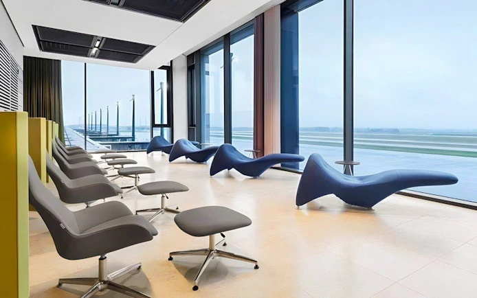 BER Lounge seating area with runway view at Berlin Brandenburg Airport Terminal 1.