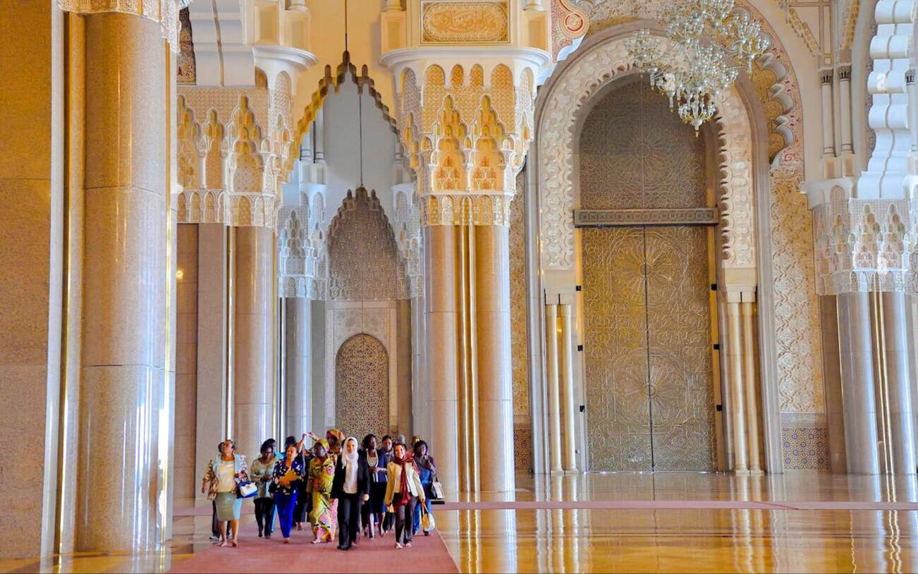 Group touring Hassan II Mosque interior, Casablanca, Morocco.