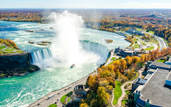 Niagara Falls with tour boat approaching Horseshoe Falls, Canada.