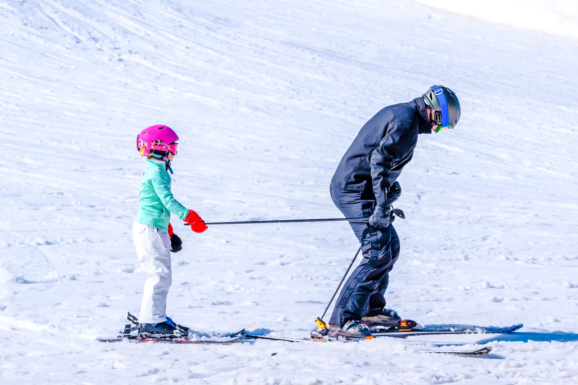 Child learning to ski with instructor at Valle Nevado, Santiago.