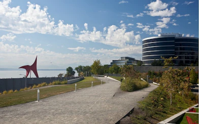 Seattle Olympic Sculpture Park with red sculpture and modern buildings.