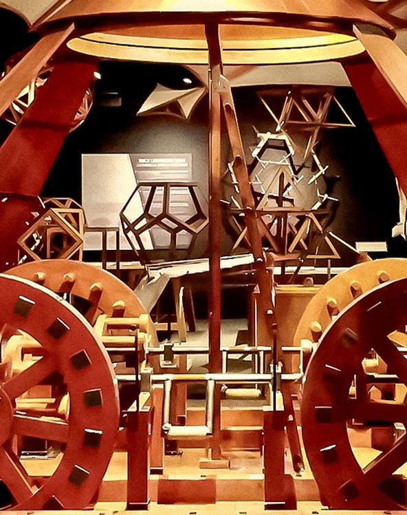 Leonardo Interactive Museum exhibit featuring mechanical models and geometric structures.