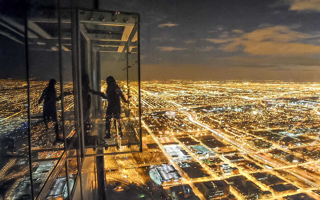 View of Chicago city lights from Willis Tower Skydeck at night.