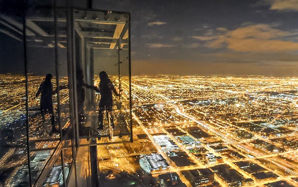 View of Chicago city lights from Willis Tower Skydeck at night.