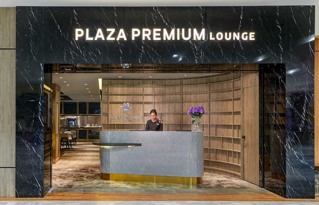 Langkawi Plaza Premium Lounge seating area with travelers relaxing and enjoying amenities.
