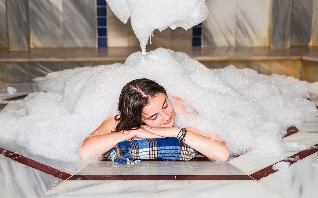 Relaxing in a foam-filled Turkish bath in Antalya.
