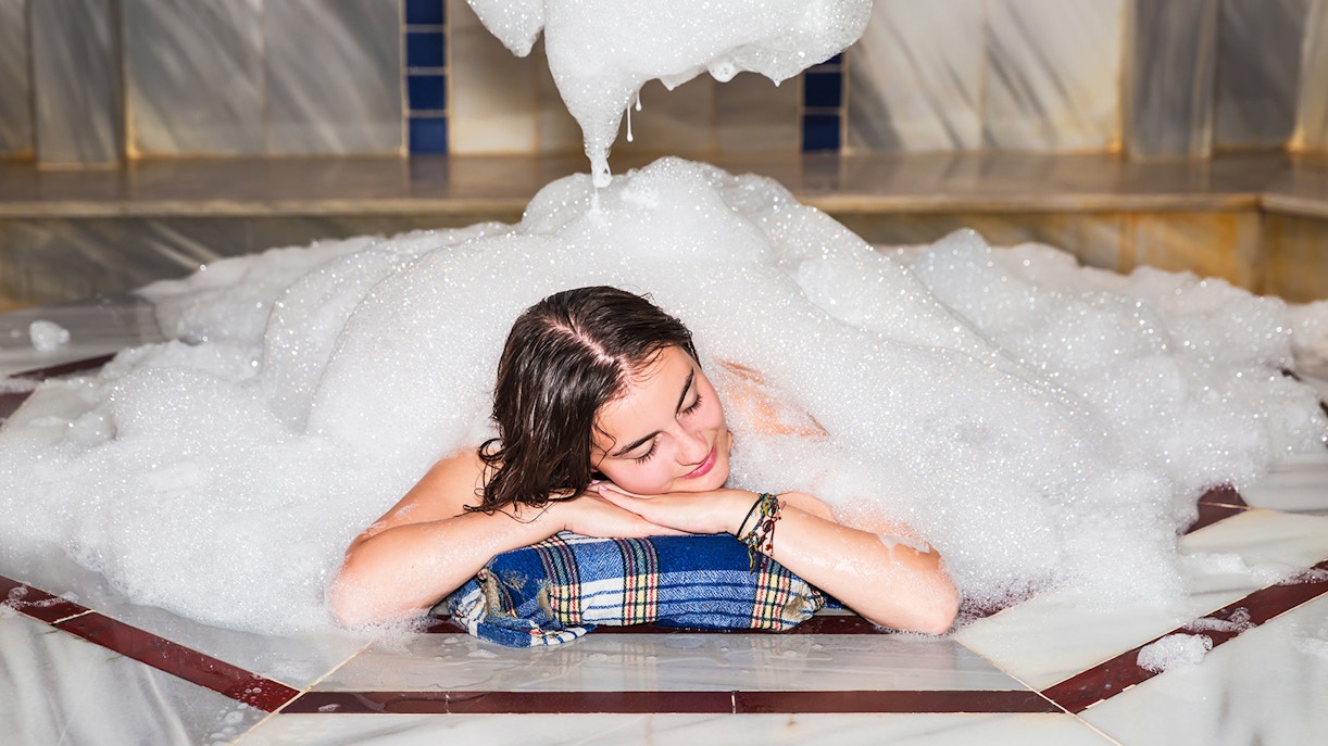 Traditional Turkish bath with massages in istanbul, featuring marble interiors and relaxing spa treatments.