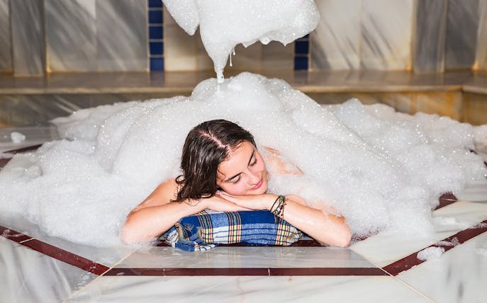 Relaxing in a foam-filled Turkish bath in Antalya.