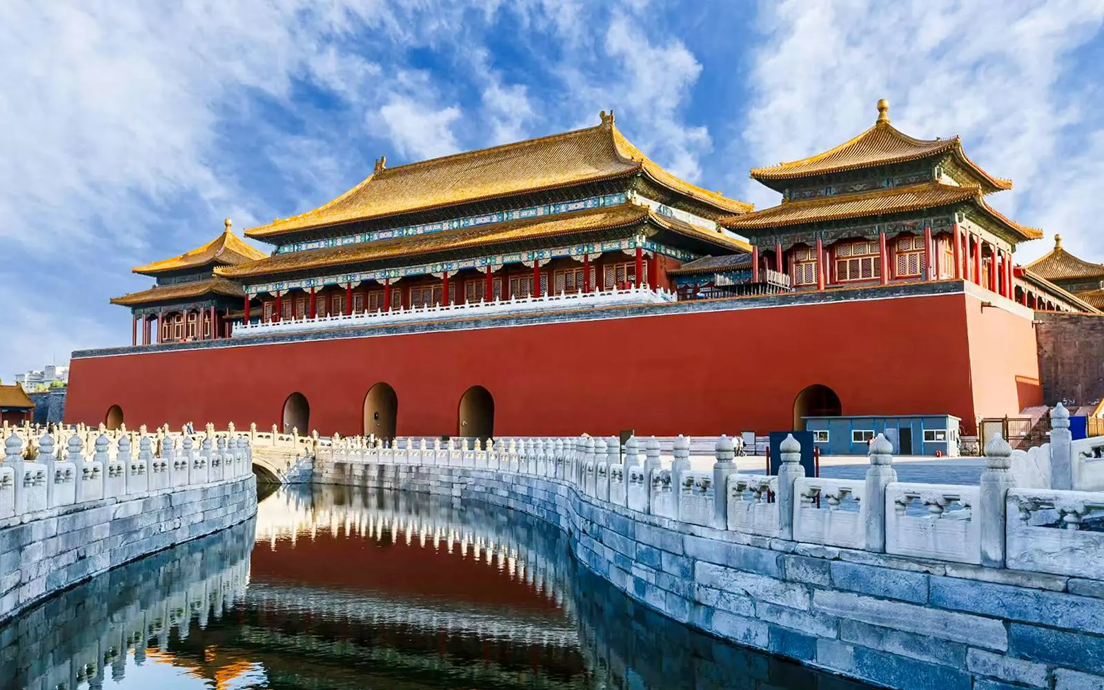 Meridian Gate of the Forbidden City with reflection in moat, Beijing, China.