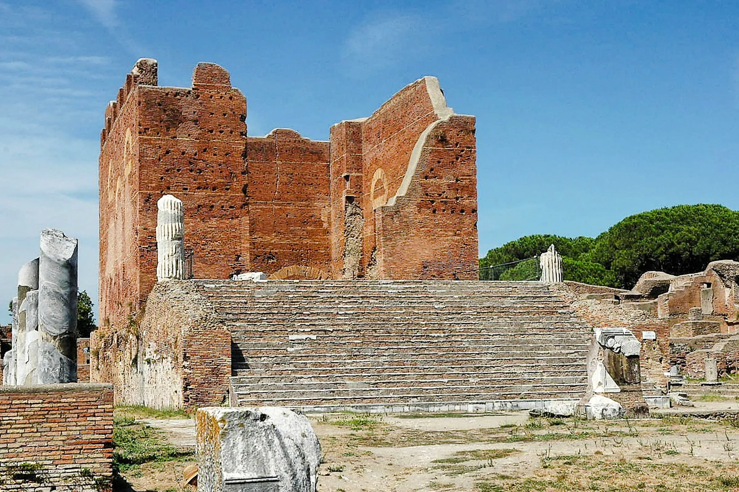 Ostia Antica ruins with ancient brick structure and marble columns, Rome.