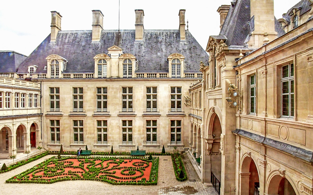 Carnavalet Museum courtyard with manicured garden, Paris.