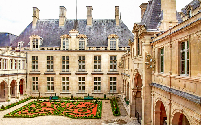 Carnavalet Museum courtyard with manicured garden, Paris.