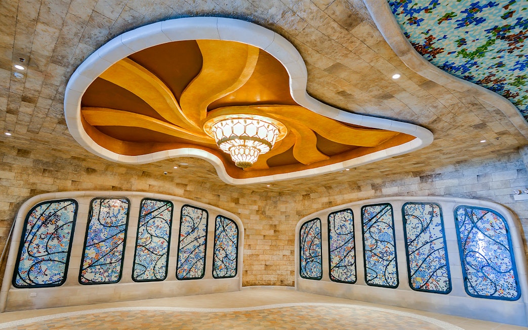Stained glass windows and ornate ceiling inside Sun World Ba Den Mountain.
