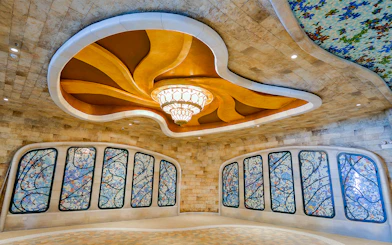 Stained glass windows and ornate ceiling inside Sun World Ba Den Mountain.