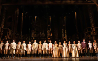 Cast of Hamilton performing on West End stage, London.