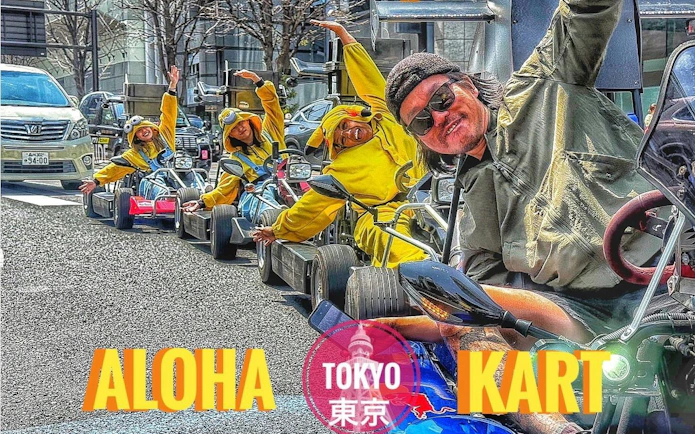 Participants in costumes driving go-karts on a Tokyo street during a guided tour.