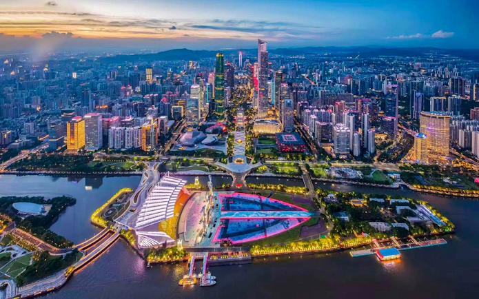 Night view of Canton Tower and Guangzhou skyline along the Pearl River.