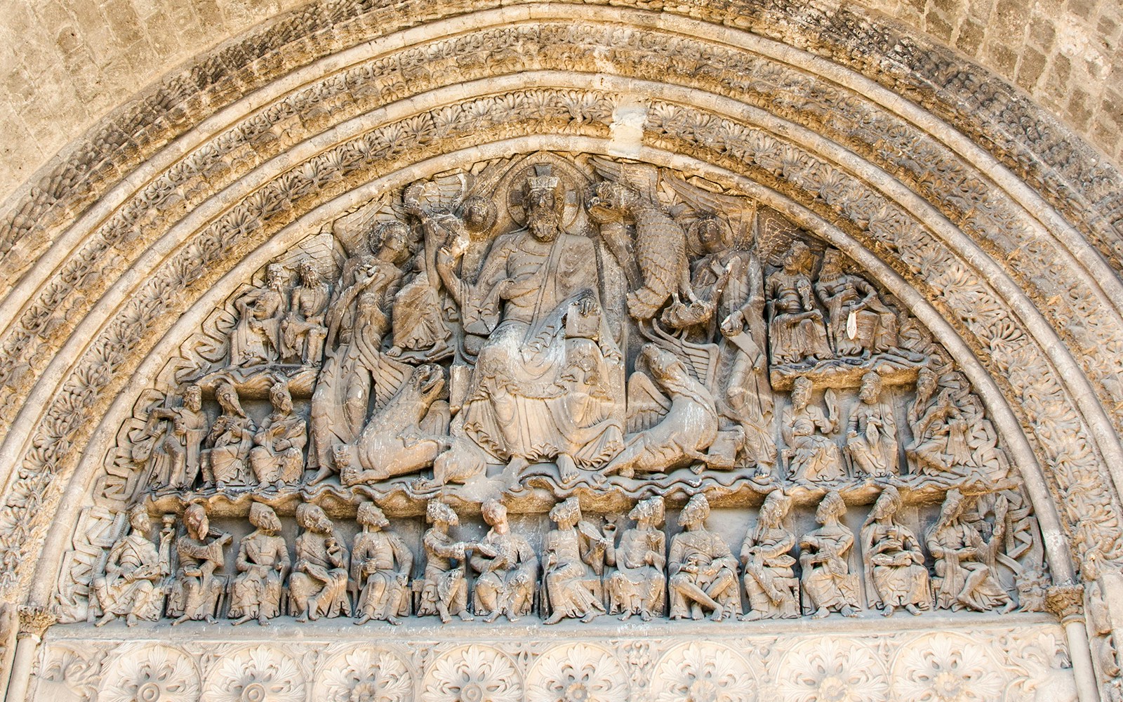 Stone carvings on the tympanum of Abbaye de Cluny, Lyon, France.