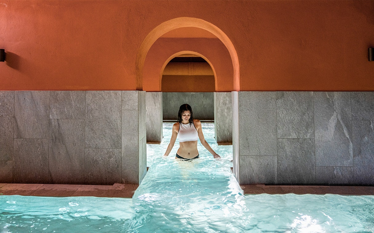Visitor enjoying the pool at QC Terme Milano Resort & Spa.