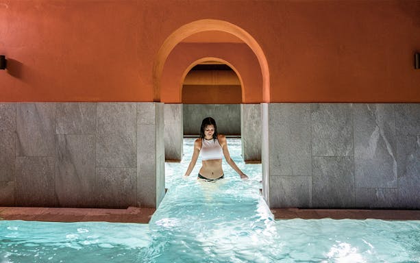 Visitor enjoying the pool at QC Terme Milano Resort & Spa.