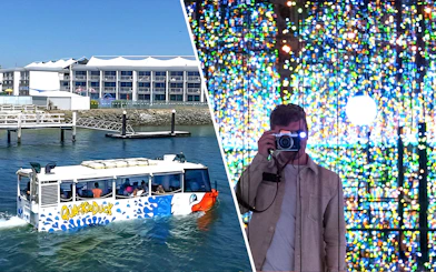 Quack'rDuck tour boat on Gold Coast waterway and person photographing colorful light display.