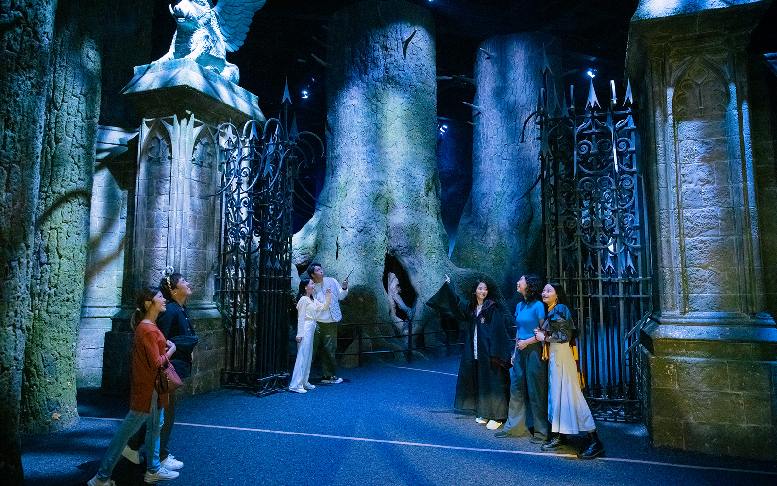 Visitors exploring the Forbidden Forest exhibit at Harry Potter attraction in Tokyo.