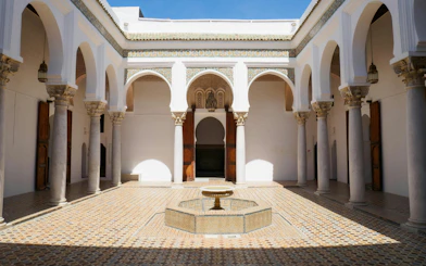 Courtyard with arches and fountain at Kasbah Tanger, Morocco.