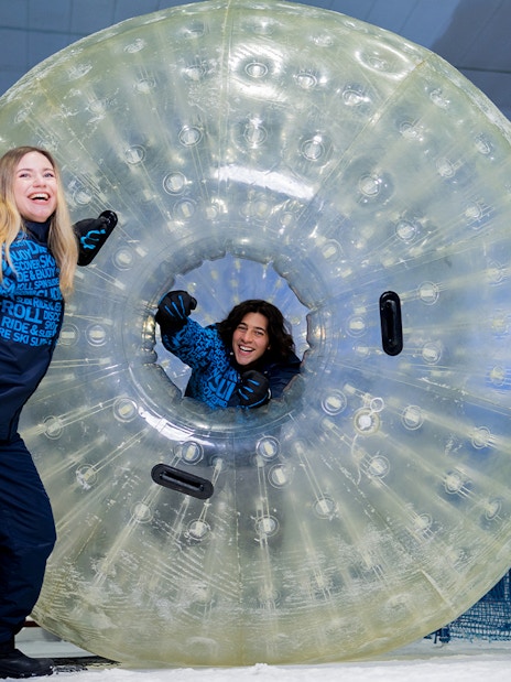 People enjoying a giant ball ride at Ski Dubai Snow Park.