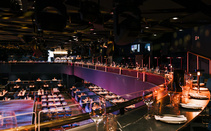 Seating area with tables set for dining at Sala Scala, Gran Canaria.