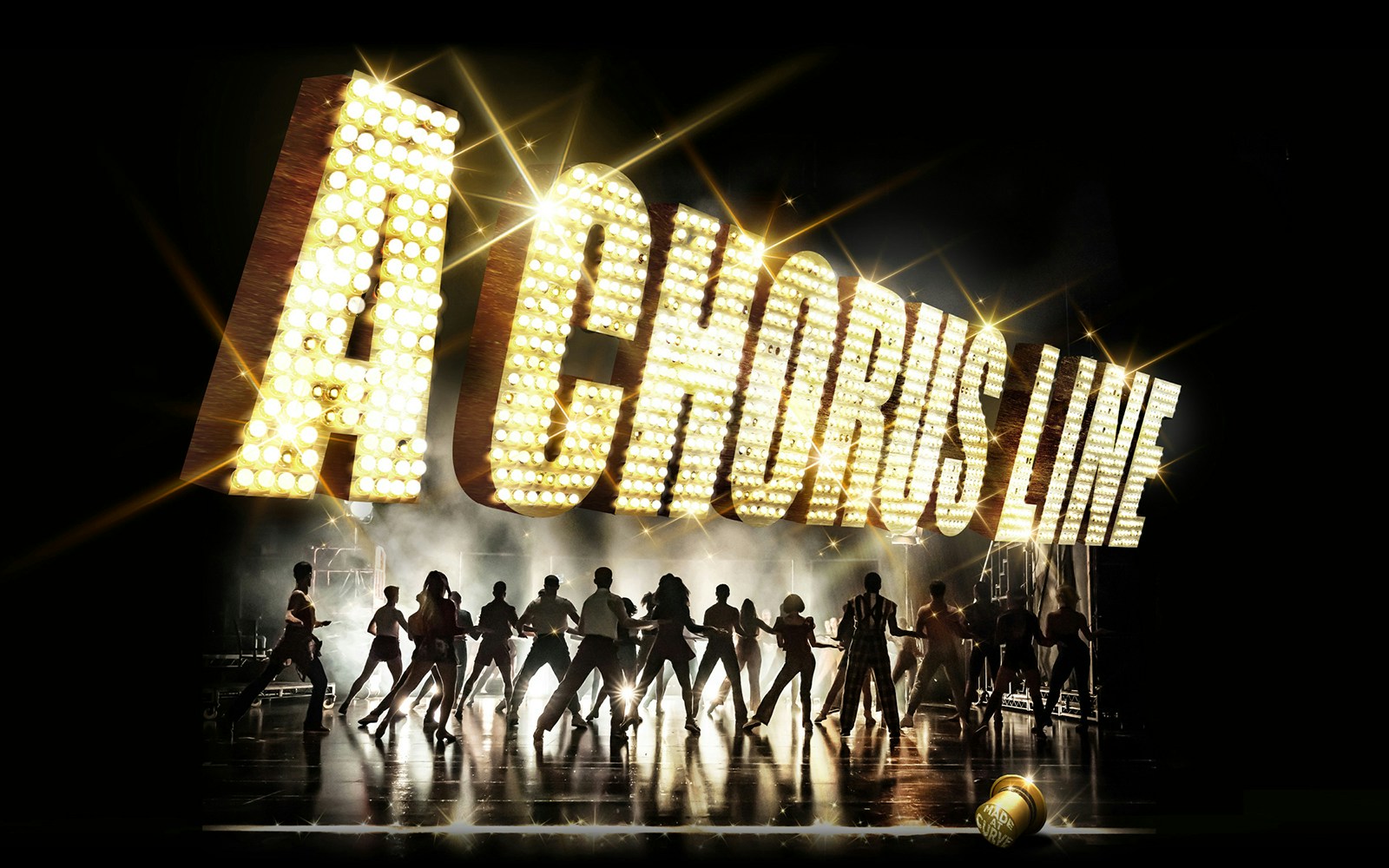 Dancers performing under illuminated "A Chorus Line" sign on stage.