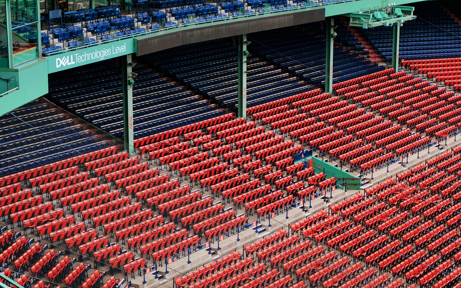 Fenway Park seating area in Boston with red and blue seats.