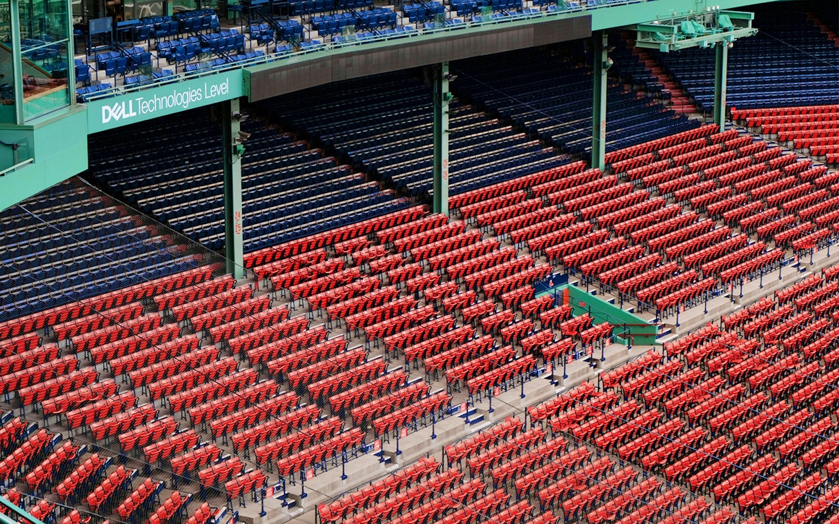 Fenway Park seating area in Boston with red and blue seats.