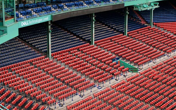 Fenway Park seating area in Boston with red and blue seats.