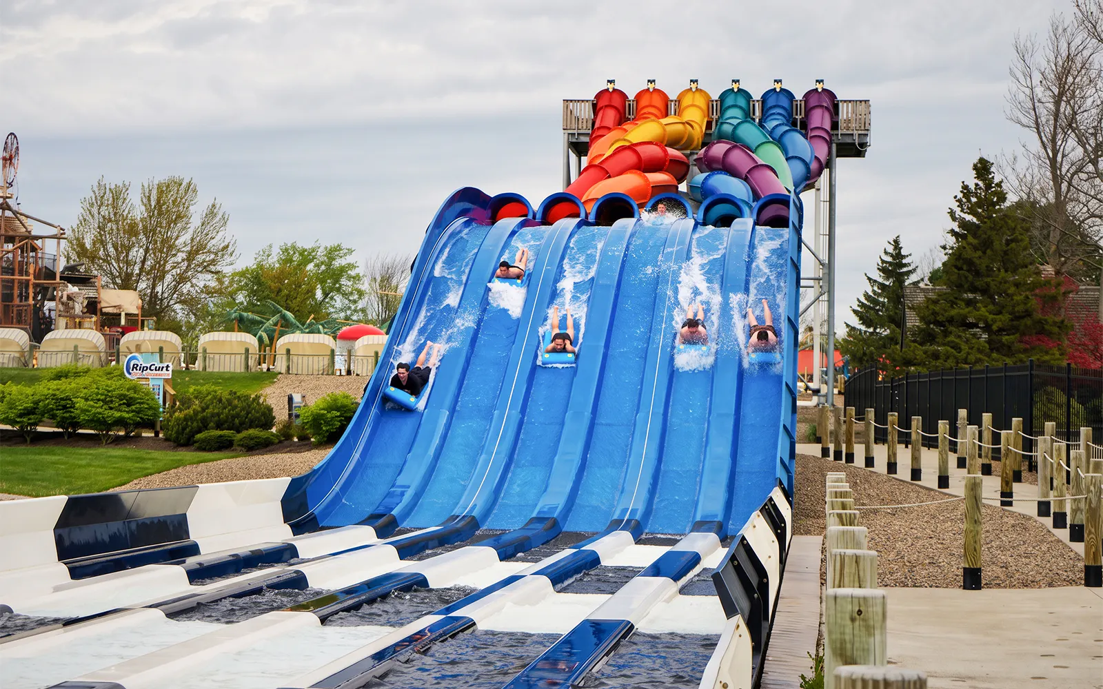 Visitors racing down RipCurl Racer water slides at Six Flags Darien Lake.
