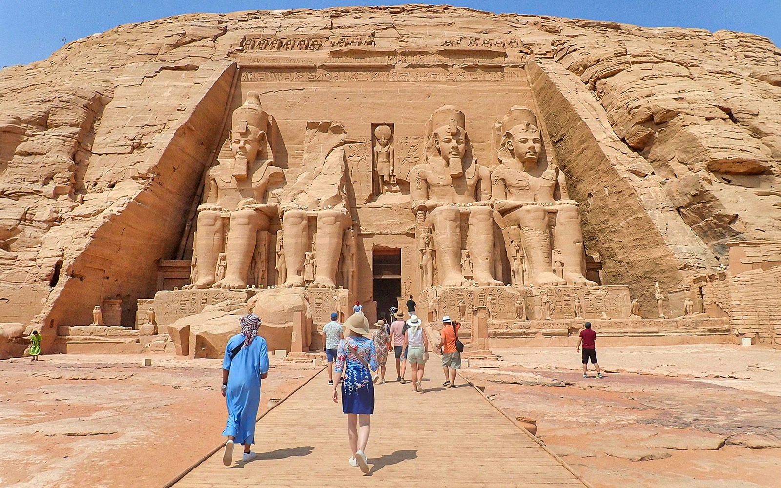 Visitors approaching the Abu Simbel Temple Complex in Egypt.