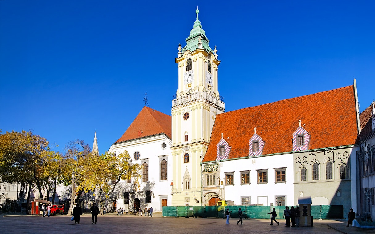 City Hall in the Old Town of Bratislava, Slovakia, with its distinctive clock tower and red roofs.