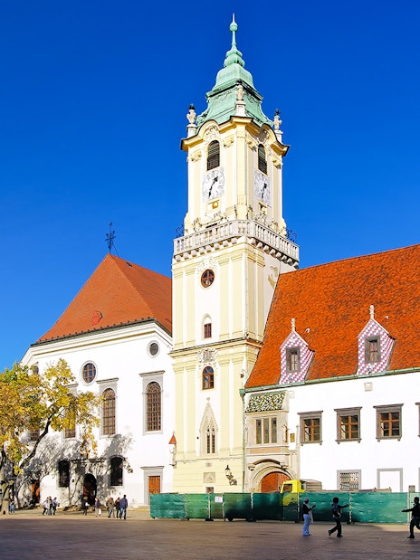 City Hall in the Old Town of Bratislava, Slovakia, with its distinctive clock tower and red roofs.