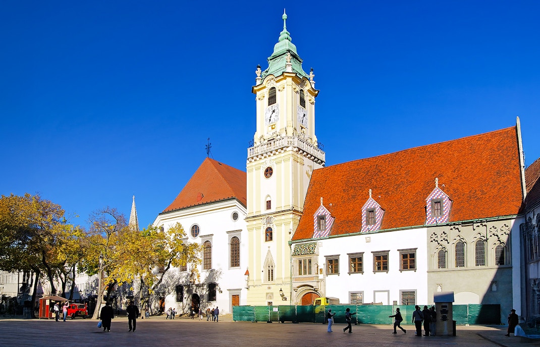 City Hall in the Old Town of Bratislava, Slovakia, with its distinctive clock tower and red roofs.