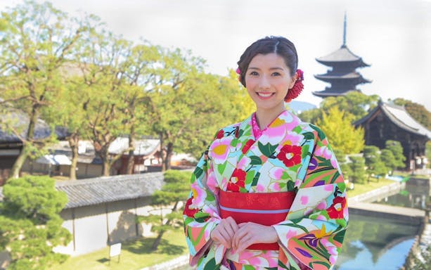 Kimono rental experience at Kiyomizu Temple, Kyoto with traditional pagoda in background.