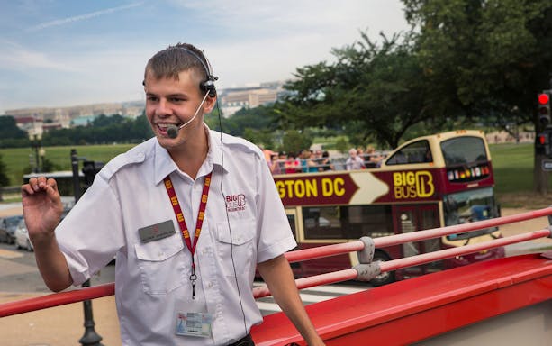 Tour guide speaking on a Big Bus Tours double-decker in Washington, D.C.