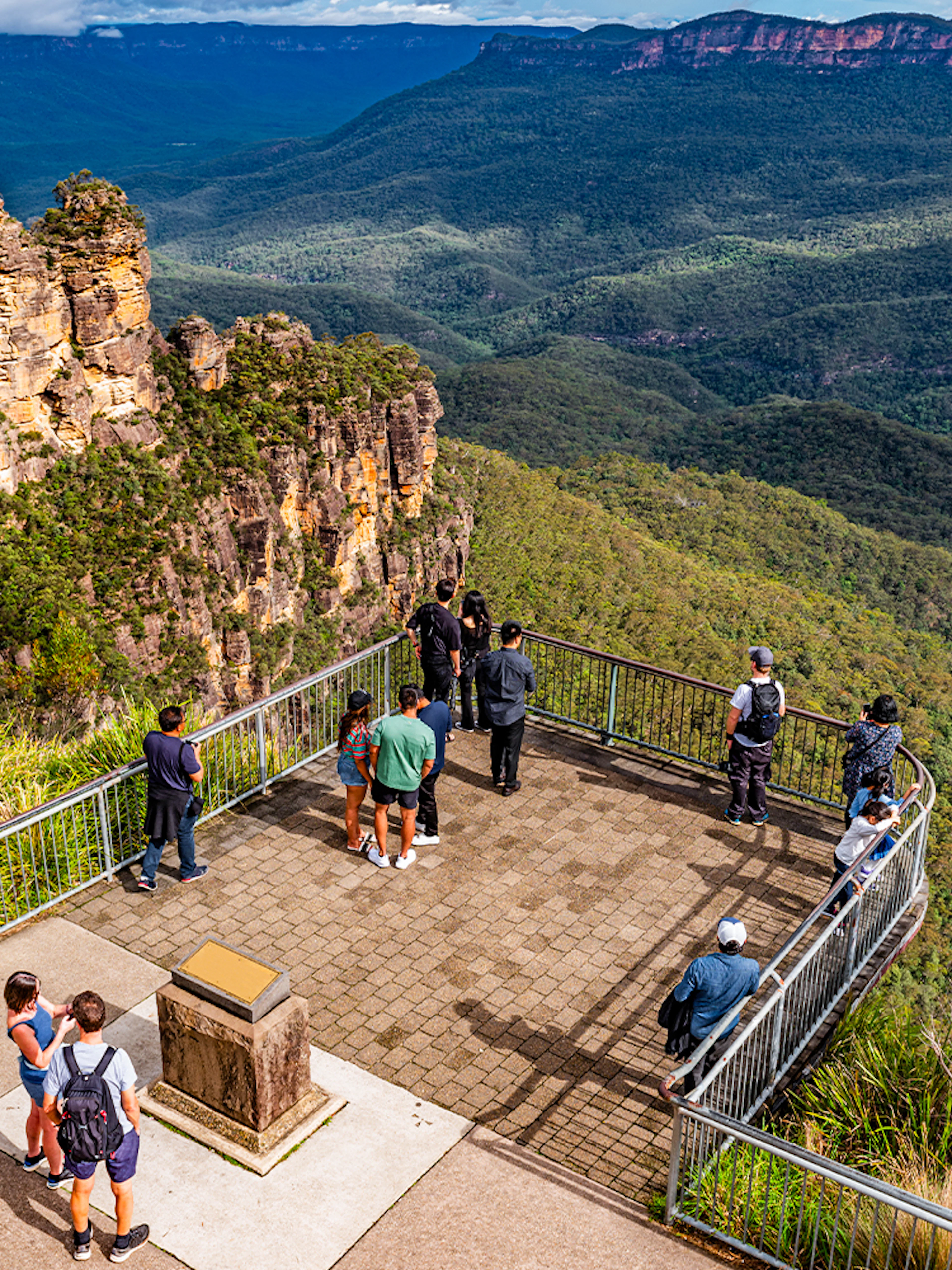 Visitors at Echo Point lookout viewing the Three Sisters rock formation in Blue Mountains, Australia.