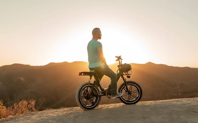 eBiker enjoying Chianti sunset view on a hilltop.