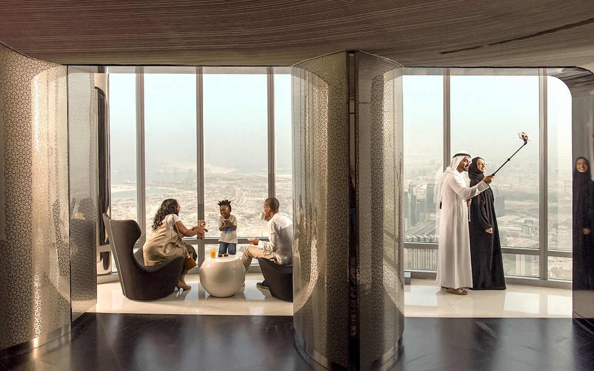 People enjoying refreshments and city view at the lounge, level 148, Burj Khalifa.